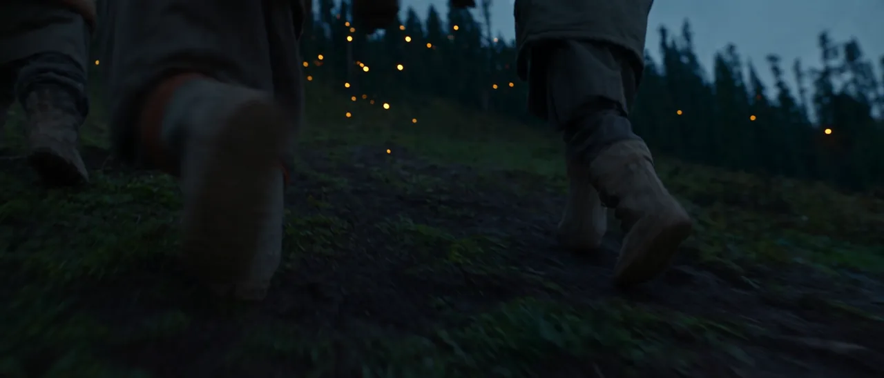 Three children gathering around fireflies in the original film Fireflies of the Ridge